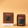 Vela Aromática con fragancia de mirra arábica y oud en envase de vidrio ámbar