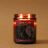 Vela Aromática con fragancia de orquídea negra y lirio en envase de vidrio ámbar