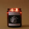 Vela Aromática con fragancia de rosa blanca y pera en envase de vidrio ámbar